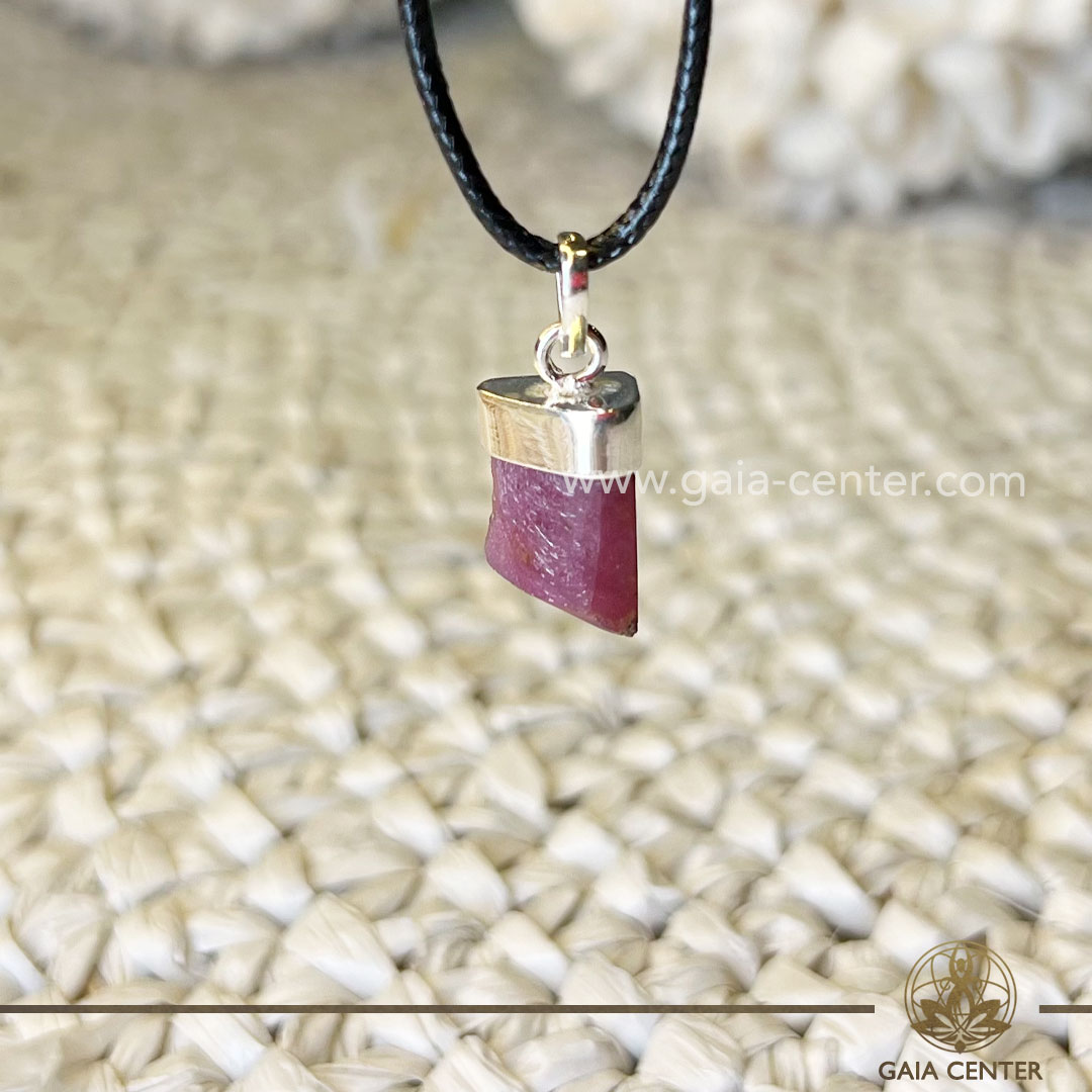 Ruby Pendant Rough with Sterling silver setting from Brazil at GAIA CENTER Crystal Shop in Cyprus. Ruby is renowned for its association with passion and love. Wearing this pendant may infuse your aura with a warm and passionate energy, promoting a sense of love and vitality in your life. Crystal and Gemstone Jewellery Selection at Gaia Center Crystal shop in Cyprus. Order online, Cyprus islandwide delivery: Limassol, Larnaca, Paphos, Nicosia. Europe and Worldwide shipping.