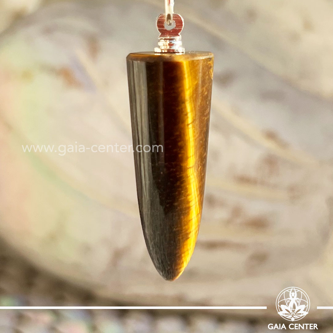 Tiger's Eye Crystal Point Pendant in a polished point shape at Gaia Center Crystal shop in Cyprus. Tigers Eye is a gemstone of courage, personal power and strength. Stone of protection. Brings good luck and prosperity. Order crystals online, Cyprus islandwide delivery: Limassol, Larnaca, Paphos, Nicosia. Europe and Worldwide shipping.