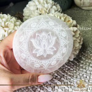 Selenite Charging Plate - Lotus Mandala |10cm| at Gaia Center Crystal shop in Cyprus. A Selenite Charging Plate is a flat slab or disk made from the crystal Selenite. Selenite is a form of gypsum and is known for its high vibrational energy and cleansing properties. The charging plate is often used as a base to cleanse and charge other crystals, jewelry, or personal items. Order crystals online, Cyprus islandwide delivery: Limassol, Larnaca, Paphos, Nicosia. Europe and Worldwide shipping.
