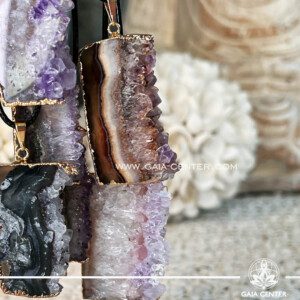 Amethyst Crystal Pendant Slab Slice |Gold Plated| at Gaia Center Crystal shop in Cyprus. Amethyst, with its captivating allure and mystical properties, symbolizes spiritual enlightenment and inner tranquility. The Amethyst Crystal Pendant Slab Slice Geode from Brazil epitomizes nature's artistry. Order crystals online, Cyprus islandwide delivery: Limassol, Larnaca, Paphos, Nicosia. Europe and Worldwide shipping.
