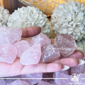 Pink Rose Quartz Rough natural unpolished crystal quartz clusters from Madagascar at GAIA CENTER Crystal shop in Cyprus. Rose Quartz purifies and opens the heart at all levels to promote love, self-love, friendship, deep inner healing and feelings of peace. Rose quartz promotes gentleness and love and stimulates positive emotional interactions, how to love oneself (again) as well as others. Crystal tumbled stones and rough minerals, drusy at Gaia Center crystal shop in Cyprus. Order crystals online top quality crystals, Cyprus islandwide delivery: Limassol, Larnaca, Paphos, Nicosia. Europe and Worldwide shipping.