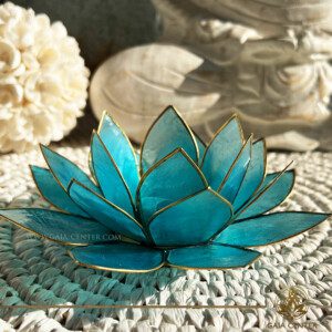 Lotus Flower Candle Holder - Blue Gold Trim |Capiz Shell| at GAIA CENTER crystal store in Cyprus. Enhance your home décor with our exquisite Lotus Flower Candle Holder made from genuine Capiz Shell. This stunning piece combines natural elegance with artisanal craftsmanship, featuring a delicate lotus design that glows beautifully when lit. Perfect for creating a serene ambiance, this candle holder is ideal for meditation spaces, living rooms, or as a unique gift. Discover the timeless beauty of Capiz shell and add a touch of serenity and sophistication to any setting