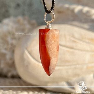 Carnelian Polished Point Pendant at Gaia Center Crystal shop in Cyprus. he vibrant energy of the Carnelian Crystal Pendant, available at our crystal shop in Cyprus and for convenient online orders. Known for its warm, fiery hues and powerful healing properties, Carnelian is a stone of motivation, courage, and vitality. Order crystals online, Cyprus islandwide delivery: Limassol, Larnaca, Paphos, Nicosia. Europe and Worldwide shipping.