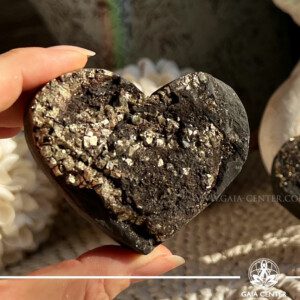 Pyrite on Basalt Heart 150-200g | from Brazil at Gaia Center Crystal shop in Cyprus. Pyrite is an active grounding stone that promotes vitality and a positive flow of energy. The heart shape adds an extra layer of meaning, emphasizing the crystal's connection to matters of the heart, including self-love and emotional well-being. Order crystals online, Cyprus islandwide delivery: Limassol, Larnaca, Paphos, Nicosia. Europe and Worldwide shipping.