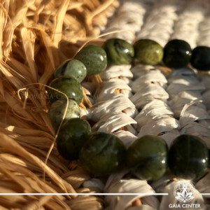 Nephrite Jade Tumbled Stones Bracelet, available at the GAIA CENTER Crystal Store in Cyprus. Perfect for enhancing harmony and prosperity, this exquisite bracelet is crafted from genuine Nephrite Jade. Visit us in-store or order online for worldwide delivery. Shop now and embrace the natural power of crystals!