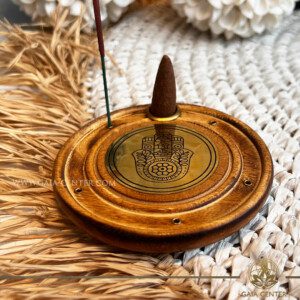 Incense Holder Mango Wood Round Ash Catcher - Hand of Fatima. Holds five aroma incense sticks and one incense pyramids or cone. Made from wood with artistic design. Incense burners selection at Gaia Center Crystal Incense Shop in Cyprus. Order online, Cyprus islandwide delivery: Limassol, Larnaca, Nicosia, Paphos. Europe and worldwide shipping.