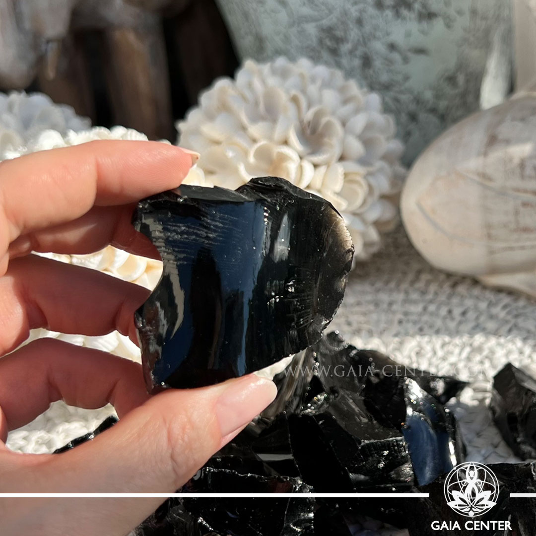 Black Obsidian rough natural crystal cluster – protection and grounding stone available at Gaia Center Cyprus.