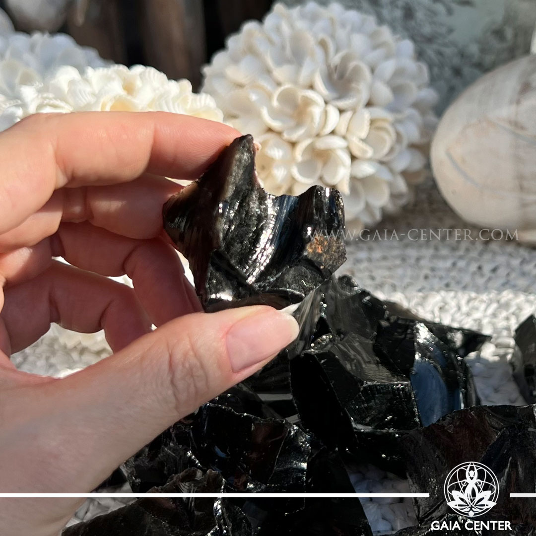 Black Obsidian rough natural crystal cluster – protection and grounding stone available at Gaia Center Cyprus.
