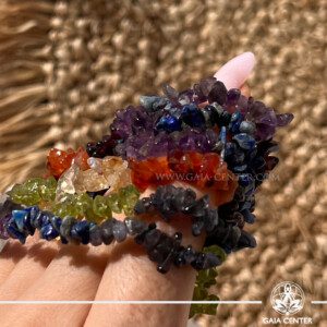 7 chakra chips crystal bracelet. This bracelet is made with seven different types of crystal chips representing the chakras which are: Amethyst, Lapis lazuli, Iolite, Perdiot, Citrine, Carnelian, Garnet. Amethyst (Crown Chakra) – Brings spiritual clarity, peace, and connection to higher consciousness. Lapis Lazuli (Third Eye Chakra) – Enhances intuition, inner wisdom, and mental focus. Iolite (Throat Chakra) – Supports clear communication, self-expression, and truth. Peridot (Heart Chakra) – Encourages emotional healing, compassion, and heart-centered growth. Citrine (Solar Plexus Chakra) – Boosts confidence, personal power, and joyful energy. Carnelian (Sacral Chakra) – Ignites creativity, passion, and emotional vitality. Garnet (Root Chakra) – Grounds your energy, offering strength, stability, and protection. These are genuine crystals, not imitations. Bracelet at Gaia Center Crystal Shop in Cyprus. Order crystals online, Cyprus islandwide delivery: Limassol, Larnaca, Paphos, Nicosia. Europe and Worldwide shipping.
