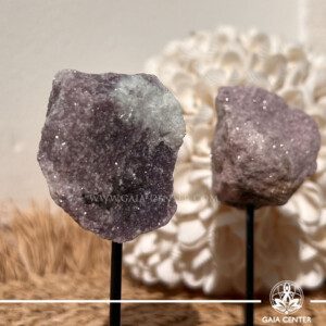 Lepidolite crystal on display pin from Madagascar with lilac mica shimmer at GAIA CENTER Crystal shop in Cyprus.