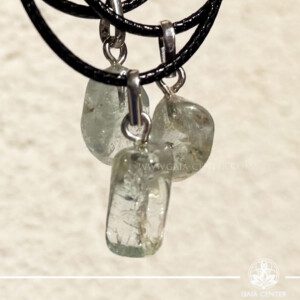 Natural blue topaz crystal pendants with polished gemstones in silver settings