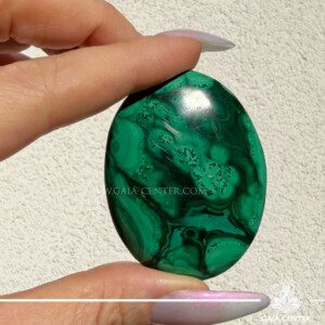 Polished Malachite smooth palmstone with rich green natural banding for protection and emotional healing.