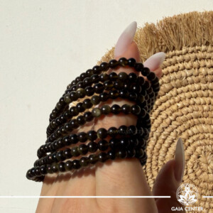 Gold Sheen Obsidian Crystal Bracelet made with genuine natural gemstone beads featuring a radiant golden shimmer, available online at Gaia Center Crystal Shop Cyprus. Authentic Gold Sheen Obsidian bracelet for protection, confidence, personal power, grounding and spiritual wellbeing with Cyprus-wide delivery.