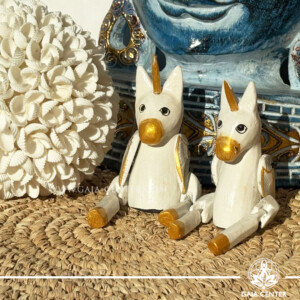 Hand-carved wooden unicorn from Bali, a mystical spiritual totem symbolising intuition, protection and inner strength.