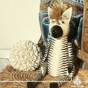 Hand-carved wooden zebra totem made in Bali, Indonesia, representing balance and individuality