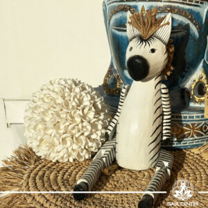 Hand-carved wooden zebra totem made in Bali, Indonesia, representing balance and individuality