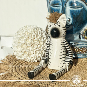 Hand-carved wooden zebra totem made in Bali, Indonesia, representing balance and individuality