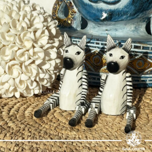 Hand-carved wooden zebra totem made in Bali, Indonesia, representing balance and individuality