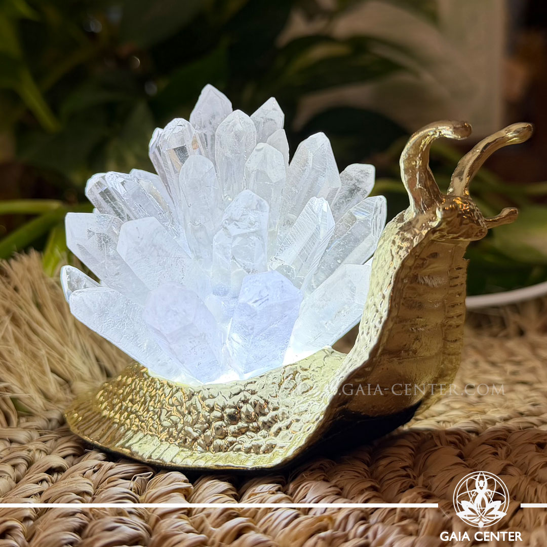 Crystal lamp featuring a decorative snail with sparkling quartz points, available from a crystal shop in Cyprus.
