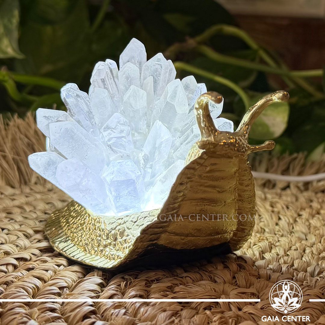 Crystal lamp featuring a decorative snail with sparkling quartz points, available from a crystal shop in Cyprus.