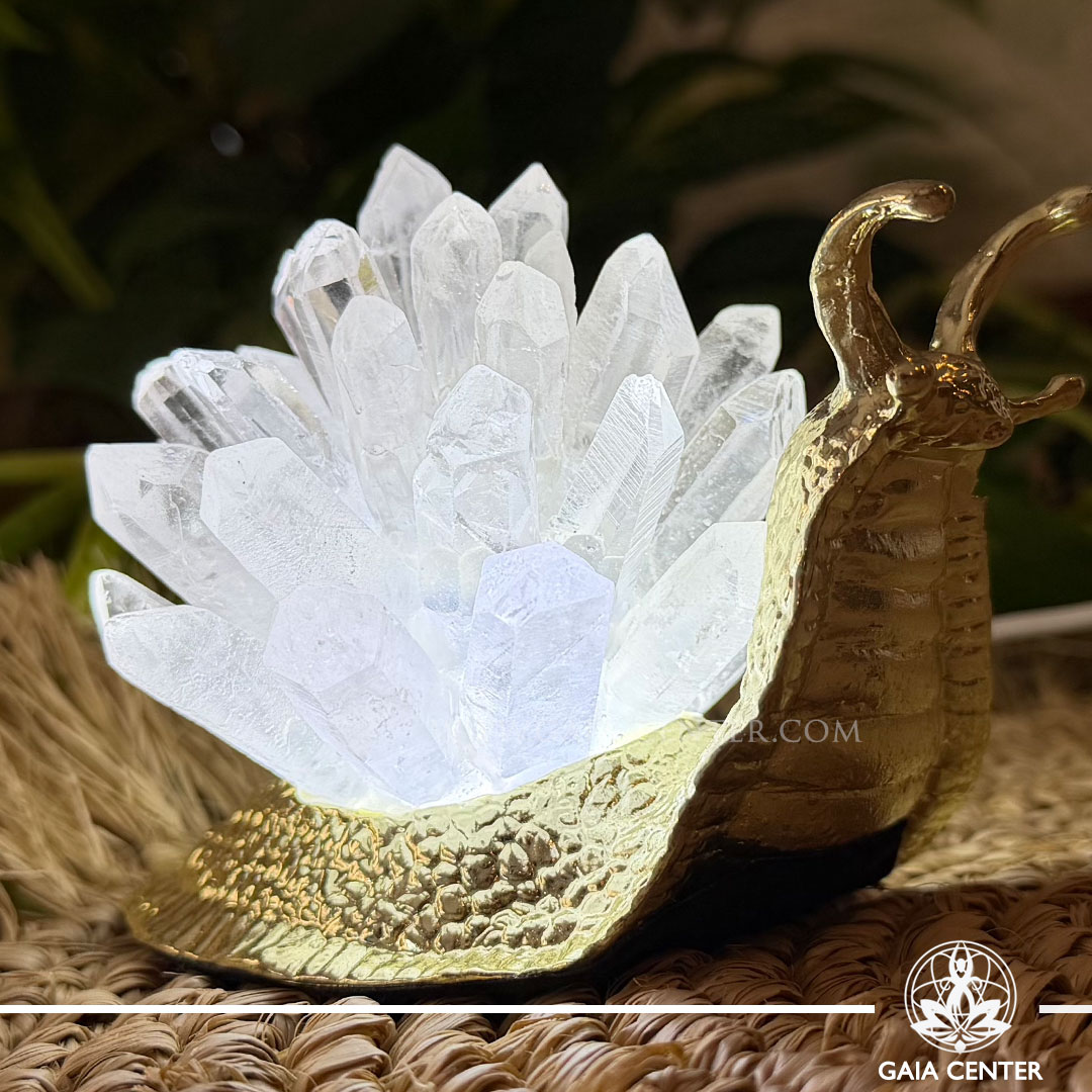 Crystal lamp featuring a decorative snail with sparkling quartz points, available from a crystal shop in Cyprus.