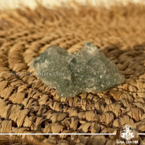 Natural green apophyllite crystal cluster with a stalactite druze formation, available at a crystal shop in Cyprus.