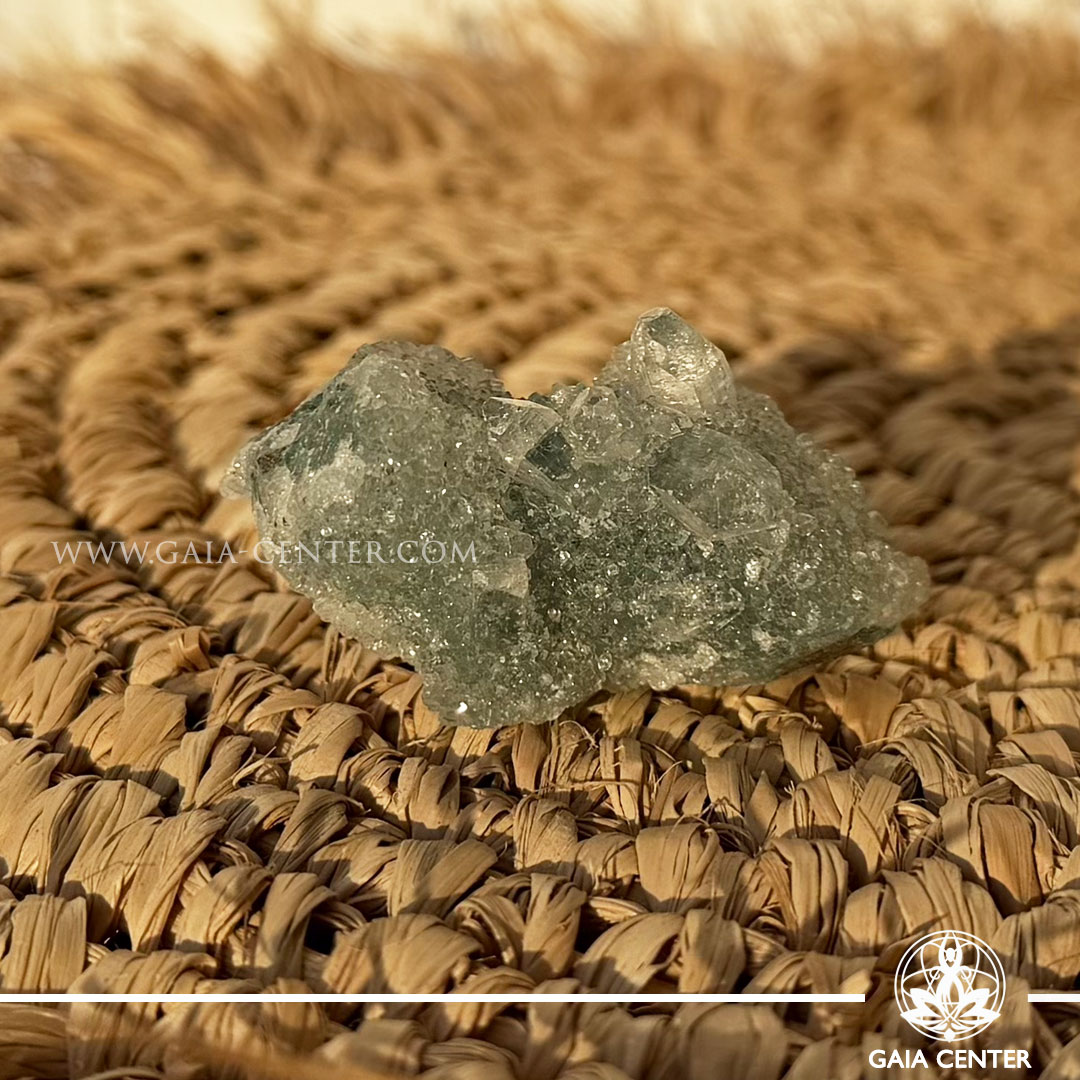 Natural green apophyllite crystal cluster with a stalactite druze formation, available at a crystal shop in Cyprus.