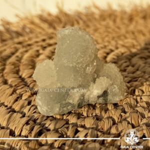 Natural green apophyllite crystal cluster with a stalactite druze formation, available at a crystal shop in Cyprus.