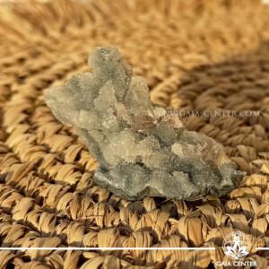 Natural green apophyllite crystal cluster with a stalactite druze formation, available at a crystal shop in Cyprus.