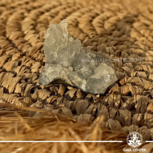 Natural green apophyllite crystal cluster with a stalactite druze formation, available at a crystal shop in Cyprus.