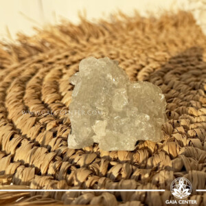 Natural green apophyllite crystal cluster with a stalactite druze formation, available at a crystal shop in Cyprus.